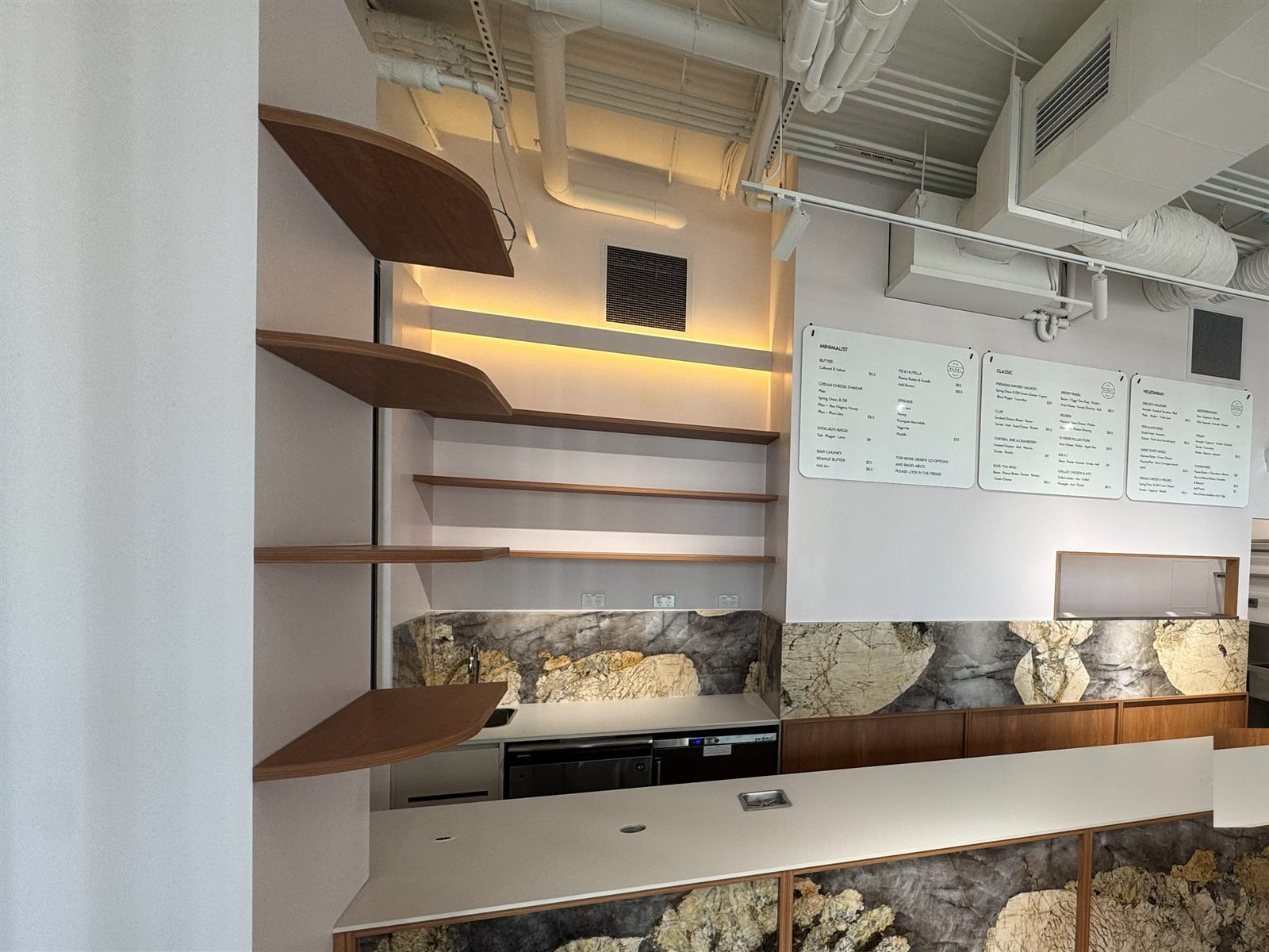 Completed servery counter, timber shelving and menu boards at NYC Bagel Deli
