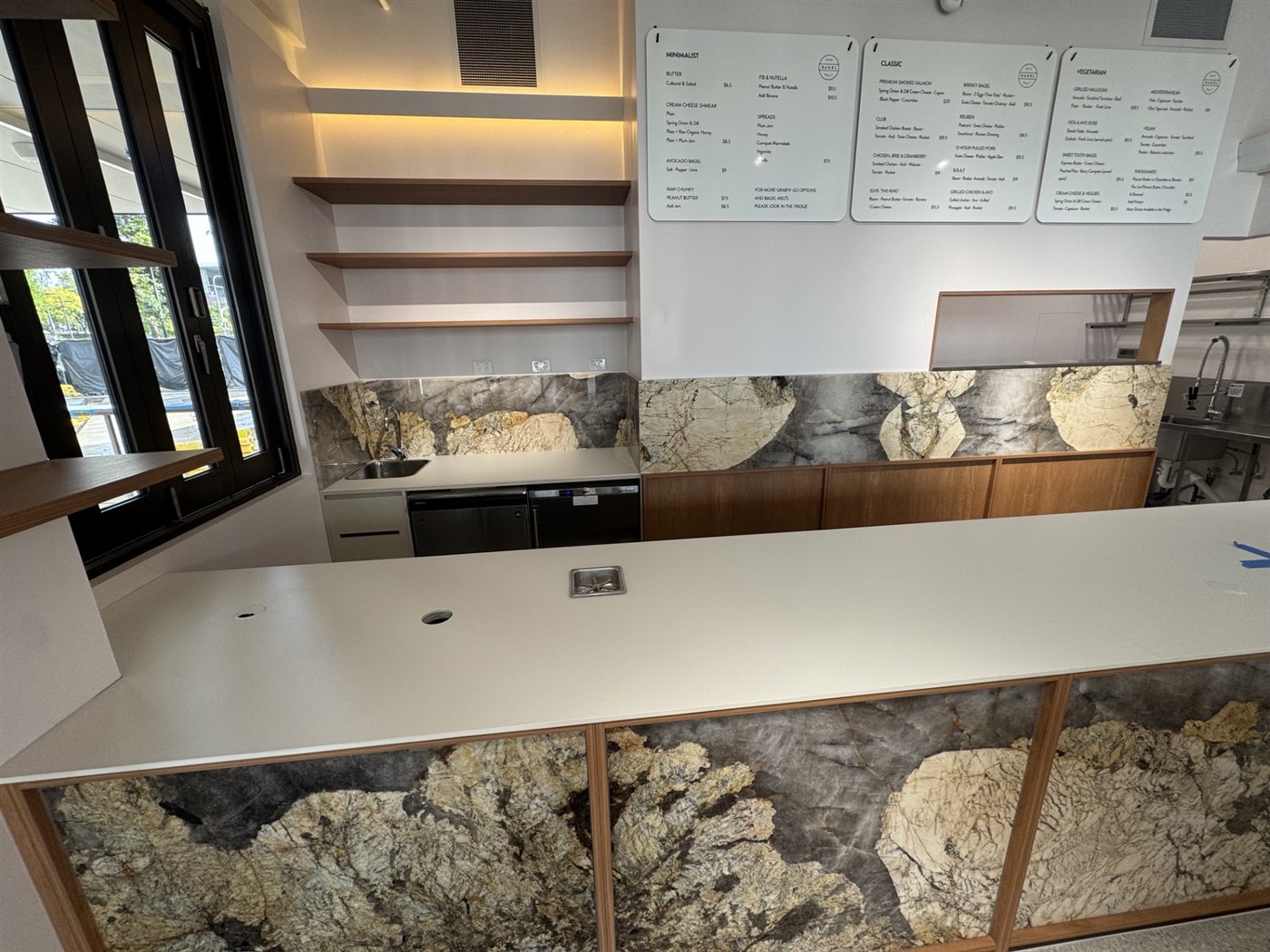 Servery counter and marble splashback at NYC Bagel Deli